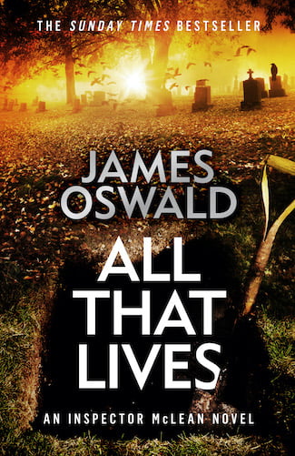 Cover image for All That Lives, book twelve in the Inspector McLean series by James Oswald. Cover shows an open grave, spade handle poking out of it, orange dawn light filtering in through trees and past headstones in the background